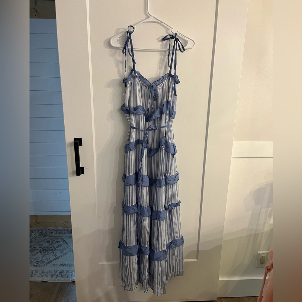 Gauzy blue & white dress with tie straps, tiered design, and an elastic chest.